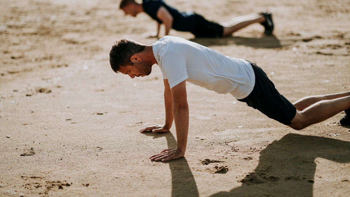 Men working out together, pushups